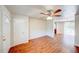 Inviting living space with wood floors, ceiling fan, and easy access to other parts of the home at 14 Cyclops Dr, Apopka, FL 32703