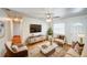 Comfortable living room boasts hardwood floors, stylish furniture, and an open floor plan at 14 Cyclops Dr, Apopka, FL 32703