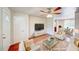 Comfortable living room boasts hardwood floors, stylish furniture, and an open floor plan at 14 Cyclops Dr, Apopka, FL 32703