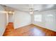 Bright living room with hardwood floors, a ceiling fan, and a front door and window for ample natural light at 14 Cyclops Dr, Apopka, FL 32703