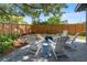Backyard area offering new pavers, chairs and a new privacy fence at 1401 Canberra Ave, Orlando, FL 32806