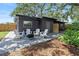 Relax in this backyard oasis with patio, pavers, and new landscaping at 1401 Canberra Ave, Orlando, FL 32806