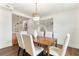 Dining room features a contemporary light fixture and a modern table for six at 1401 Canberra Ave, Orlando, FL 32806