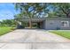 The home features carport, driveway and updated exterior paint at 1401 Canberra Ave, Orlando, FL 32806
