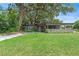 Charming single-story home boasts a manicured lawn, stylish driveway and welcoming covered entrance at 1401 Canberra Ave, Orlando, FL 32806