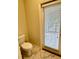 Toilet area with a view to the outside at 1513 Maidstone Ct, Davenport, FL 33896