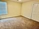 Bright bedroom featuring natural light and a spacious closet at 1513 Maidstone Ct, Davenport, FL 33896