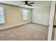 Comfortable bedroom with plush carpet and two large windows at 1513 Maidstone Ct, Davenport, FL 33896