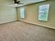 Bright bedroom with two windows providing ample natural light at 1513 Maidstone Ct, Davenport, FL 33896