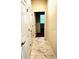 Hallway featuring tile floors and convenient access to other rooms at 1513 Maidstone Ct, Davenport, FL 33896