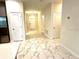 Bright foyer features ceramic tile flooring, neutral wall colors, and an entry door at 1513 Maidstone Ct, Davenport, FL 33896