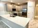 Bright kitchen featuring stainless steel appliances and a large countertop at 1513 Maidstone Ct, Davenport, FL 33896