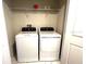 Convenient laundry room with modern, front-loading machines at 1513 Maidstone Ct, Davenport, FL 33896