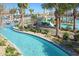 Enjoy the relaxing lazy river surrounded by tropical landscaping at 1513 Maidstone Ct, Davenport, FL 33896