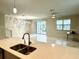 Open-concept living room with abundant natural light and stylish flooring at 1513 Maidstone Ct, Davenport, FL 33896