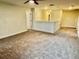Open loft area with plush carpeting and ample space at 1513 Maidstone Ct, Davenport, FL 33896