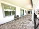 Spacious covered patio features a tiled floor, providing an ideal outdoor entertainment space at 1513 Maidstone Ct, Davenport, FL 33896