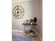 Decorated bar cart featuring wine glasses, bottles, and a decorative wall clock at 15708 Orange Harvest Loop, Winter Garden, FL 34787