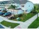 Corner lot townhome with blue siding and well-maintained landscaping at 15708 Orange Harvest Loop, Winter Garden, FL 34787