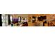 Panoramic view of an open-concept living area with modern kitchen, dining, and living room spaces at 15708 Orange Harvest Loop, Winter Garden, FL 34787