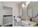 Modern bathroom with double sinks, granite countertops, and sleek fixtures at 166 Minniehaha Cir, Haines City, FL 33844