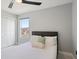 This bedroom features a ceiling fan, closet, and a window letting in natural light at 166 Minniehaha Cir, Haines City, FL 33844