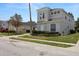Two-story home featuring beautiful front yard and ample driveway at 166 Minniehaha Cir, Haines City, FL 33844