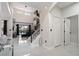 Bright and airy foyer with a staircase, high ceilings, and access to multiple rooms at 166 Minniehaha Cir, Haines City, FL 33844