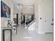 Bright foyer featuring high ceilings, staircase and modern decor at 166 Minniehaha Cir, Haines City, FL 33844