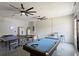 Spacious garage with game tables, perfect for entertainment and hobbies at 166 Minniehaha Cir, Haines City, FL 33844