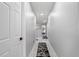 Bright hallway featuring patterned rugs, recessed lighting, and modern design elements at 166 Minniehaha Cir, Haines City, FL 33844