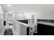 Bright upstairs loft area with railing that overlooks the staircase at 166 Minniehaha Cir, Haines City, FL 33844