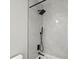 Sleek bathroom shower with rain shower head and contemporary fixtures at 166 Minniehaha Cir, Haines City, FL 33844
