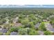 A beautiful aerial view of a residential neighborhood with mature trees and well-maintained homes at 1800 Silver Valley Ct, Apopka, FL 32712