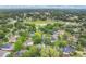Aerial view showcasing the neighborhood and lush greenery at 1800 Silver Valley Ct, Apopka, FL 32712