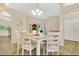 Open-concept dining area with modern lighting, stylish table set, and hardwood floors at 1800 Silver Valley Ct, Apopka, FL 32712
