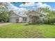 Attractive one-story home with a tidy front lawn, mature landscaping, and an attached garage at 1800 Silver Valley Ct, Apopka, FL 32712