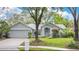 Charming single-story home with a well-manicured lawn and inviting curb appeal at 1800 Silver Valley Ct, Apopka, FL 32712