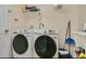 Functional laundry room featuring a modern washer and dryer set, providing convenience for chores at 1800 Silver Valley Ct, Apopka, FL 32712