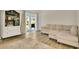 Bright living room with modern floors, a comfortable sectional sofa, and a convenient bar area at 1800 Silver Valley Ct, Apopka, FL 32712