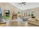Comfortable living room features hardwood floors, fireplace and many windows for natural light at 1800 Silver Valley Ct, Apopka, FL 32712