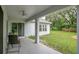 Relaxing covered patio with a ceiling fan, offering a peaceful outdoor space and views of the backyard at 1800 Silver Valley Ct, Apopka, FL 32712