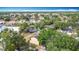 Aerial view of the neighborhood, featuring lush greenery, ponds, and ample parking spaces at 1803 Foxhall Cir # 1803, Kissimmee, FL 34741