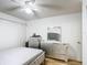 Bedroom featuring a white ceiling fan, light walls and a mirrored dresser at 1803 Foxhall Cir # 1803, Kissimmee, FL 34741