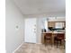 Bright entryway leading to an open kitchen with breakfast bar and tiled flooring at 1803 Foxhall Cir # 1803, Kissimmee, FL 34741