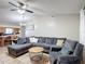 Open-concept living area with views of the adjacent kitchen and plenty of natural light at 1803 Foxhall Cir # 1803, Kissimmee, FL 34741