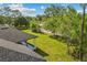 View of a spacious, grassy backyard with a covered patio, and privacy fence providing a peaceful setting at 19073 Sabal St, Orlando, FL 32833