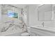 Bathroom features decorative tiling, vanity, marble countertop, and shower-tub combination at 19073 Sabal St, Orlando, FL 32833