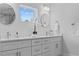 The bathroom vanity features double sinks, modern fixtures, and stylish white cabinetry at 19073 Sabal St, Orlando, FL 32833