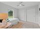 Bright bedroom featuring carpet, natural light, and a closet for ample storage at 19073 Sabal St, Orlando, FL 32833